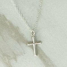 GRACE CROSS Necklace * Sterling Silver Cross Necklace * Dainty Cross Necklace* Delicate * Dainty *  Minimal * Silver Cross Necklace 14k Gold Filled GRACE Cross necklace in the last photo is sold in a separate listing:  https://www.etsy.com/listing/1737564118/grace-cross-necklace-14k-gold-filled LENGTH:  Available in:    14", 16", 18", 20" or 24"  - each comes with a 3" extender MATERIALS: Fine chain is Sterling Silver.  Clasp and connector rings are also Sterling Silver. Cross pendant is Sterling Silver and is 10x17mm.  See the photo with a ruler for size in inches.  The pendant is small and dainty. CARE:  Water and perfume are what cause most tarnishing - so the necklace needs to be stored in a dry place and not worn in the shower.  Limiting perfume in the neck area will also prolong the Necklace Simple Silver, Cross Necklace Simple, Dainty Cross Necklace, Silver Cross Necklace, Sterling Silver Cross Necklace, Sterling Silver Cross Pendant, Sterling Silver Cross, Necklace Dainty, Necklace Sterling Silver