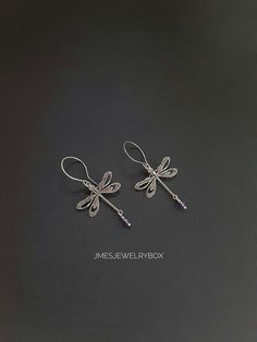 Beautiful silver dragonfly earrings with amethyst beads. Very detailed silver dragonflies are on handmade stainless steel ear hooks. Total earring length is just under 2 inches.  *Silver plated brass dragonflies  *Stainless steel ear hooks *Faceted amethyst beads  *Handmade with love <3 Like Jmesjewelrybox on Facebook for updates on new jewelry, upcoming sales and giveaways! Plus Facebook fans save 5% :D Find the coupon code on Jmesjewelrybox's cover photo https://www.facebook.com/Jmesjewelrybox Elegant Sterling Silver Dragonfly Jewelry, Handmade Sterling Silver Dragonfly Jewelry, Nickel-free Sterling Silver Dragonfly Jewelry, Handmade Silver Dragonfly Jewelry, Dainty Sterling Silver Dragonfly Jewelry, Handmade Purple Sterling Silver Earrings, Dainty Nickel-free Purple Earrings, Dainty Purple Nickel-free Earrings, Hypoallergenic Sterling Silver Dragonfly Jewelry