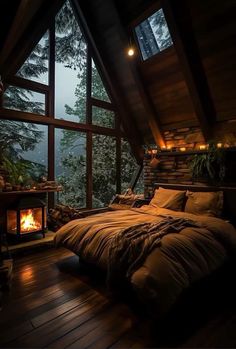 a bedroom with a bed and a fire place in the corner that is lit up