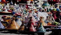 many different colored vases are on display