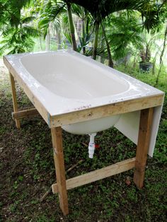 an old bathtub turned into a garden sink