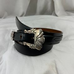 "You are looking at genuine leather belt by MM ROGERS. Belt is made of 925  silver with top grain leather.  Belt measures 37\"5 long with 31\" from the first perforation and 34\"5 at its last perforation from buckle and 1\"1 width. The front buckle measures approximately 2\"1 x 1\"6.  The condition of this belt is good and it's a great vintage find and will last you for years to come. 100% genuine MM ROGERS 4 piece belt from 1990.  Shipping Shipping is done with USPS priority mail within the U.S Black Belt With Silver Buckle, Vintage Burberry, Black Leather Belt, Genuine Leather Belt, Buckle Belt, Top Grain Leather, Black Belt, Vintage Finds, Belt Buckles