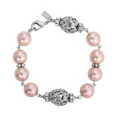 Exquisite in design and perfect for most any attire, this bracelet features round faux pearls combined with rondelle crystal beads & filigree oval beads. Available In 12MM Pink & Light Peach Faux Pearls Oval Filigree Beads & Rondelle Crystals Measurements: 8.25"L x 0.56 Lobster Clasp Closure 1928 JEWELRY COLLECTION From the vaults of rich European capitals to the antique laden attics of old American estates, 1928 Jewelry has created modern replicas of the most beautiful, exquisite vintage jewelr Chic Fashionista, Faux Pearl Bracelet, 1928 Jewelry, Vintage Inspired Jewelry, Oval Beads, Light Peach, Pink Bracelet, Pink Light, Bead Bracelet