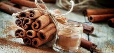 cinnamon sticks and cinnamon powder in a glass jar