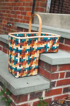 a basket is sitting on the steps outside