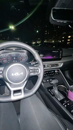 the interior of a modern car at night