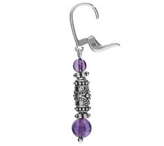 a pair of dangling earrings with purple beads