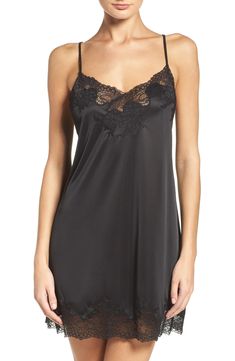 Bring an alluring style refresh to your sleepwear collection with this silky satin chemise veiled with pretty floral lace. 25 1/2" center front length (size Medium) V-neck Adjustable straps Unlined 100% polyester with 90% nylon, 10% elastane trim Machine wash, line dry Imported V-neck Satin Chemise For Wedding Night, Satin V-neck Coquette Sleepwear, Sheer V-neck Slip Dress For Sleep, Fitted Satin Finish V-neck Sleepwear, Coquette Satin V-neck Sleepwear, Coquette Slip Dress For Night, Lace Slip Dress For Sleep, Evening Modal Satin Sleepwear, Modal Satin Sleepwear For Evening