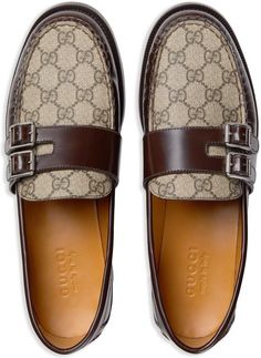 Step into luxury and timeless style with these GG Supreme Buckled Loafers from Gucci. Expertly crafted from the finest calf leather in a rich chocolate brown hue, these loafers feature a striking color-block design with iconic logo-engraved buckles. The GG Supreme canvas panels, complemented by silver-tone hardware, add a touch of sophistication to these classic slip-on loafers. Designed for both comfort and durability, these loafers boast a round toe silhouette, a branded insole, and a sturdy l Gucci Moccasins, Classic Brown, Leather Moccasins, Buy Gucci, Leather Cap, Beach Tote Bags, Sneaker Heels, Gucci Men, Handbag Shopping