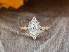 an engagement ring with a pear shaped diamond in the center