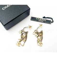 This is part of Chairish’s Costume Jewelry assortment.  Chanel Rare Vintage Gold CC Letter Dangle Hoop Earrings  *Marked 02 *This early style doesn't come with the hallmark. *Comes with the original box and the tag with style number  -It is approximately 2" x 0.5". -It is very rare and beautiful. -In an excellent condition Designer Metal Drop Earrings, Designer Single Metal Earring, Designer Drop Earrings For Pierced Ears, Designer Pierced Dangle Jewelry, Designer Dangle Earrings For Gift, High-end Gold Earrings For Gift, Designer Dangle Earrings For Formal Events, Designer Dangle Earrings For Formal Occasions, Luxury Metal Dangle Earrings