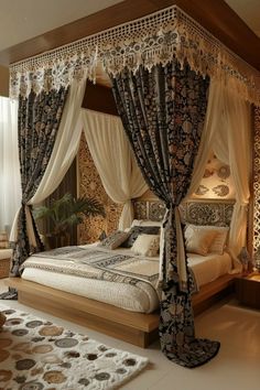 a large bed sitting in the middle of a room with curtains on it's sides