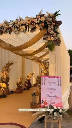 an outdoor wedding setup with flowers and decorations