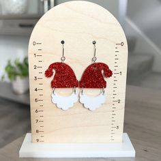 "Sparkly Santa hat dangle earrings are perfect for holiday parties! Earrings are lightweight and great for sensitive ears! 🎄 1.5\" x 1.2\" acrylic beard 🎄 1.7\" x 1.4\"\" acrylic glitter santa hat 🎄 stainless steel ear hooks 🎄 soft plastic earring backs Earrings are gift ready, and come on a card, carefully packaged inside a box. Your gift can be sent directly to the recipient, with a gift message, if desired. PROCESSING / SHIPPING Your order is shipped within 2-3 business days from order da Holiday Party Earrings, Plastic Earrings, Earrings Christmas, Holiday Earring, Party Earrings, Soft Plastic, Gift Message, Christmas Earrings, Sensitive Ears