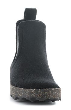 A felted finish and elastic-gore insets add to the comfort of a wool bootie made with a wool lining and distinctively waffled treads. 1 1/2" heel Pull-on style with elastic gore insets Cushioned insole Wool upper and lining/synthetic sole Made in Portugal Women's Shoes Winter Black Chelsea Boots With Suede Lining, Winter Wool Boots With Round Toe, Winter Slip-on Boots With Rubber Heel Cap, Wool Ankle Boots For Fall, Fly London, Bootie, Women's Shoes, Womens Boots, Portugal