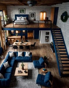 an overhead view of a living room with blue couches