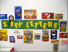 a bulletin board that has various cereals on it and the words, i spy letters