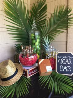 DIY Cigar Bar Havana Nights Cuban themed birthday party assorted cigars limes Chalkboard diy sign cigar boxes Fedora Palm Cigars Matchboxes and Cutters . Big hit with our guests served mojitos and Cuba Libre drinks. Cuba birthday party Havana Nights Theme DIY CIGAR BAR