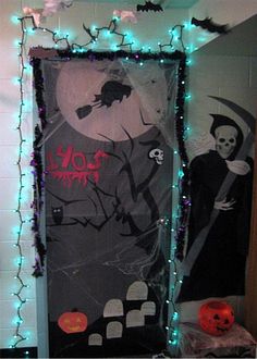 a door decorated with halloween decorations and lights