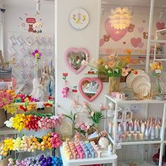 a room filled with lots of different types of toys and decorations on shelves next to each other