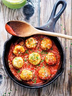 a skillet filled with meatballs and sauce