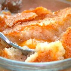 a close up of a bowl of food with a spoon