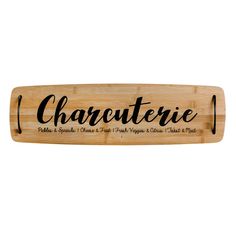 a wooden sign that says charuteriee on the front and back of it