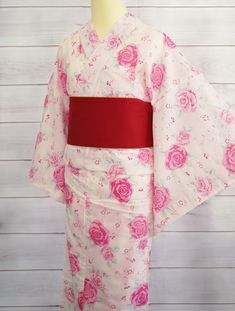 This beautiful women's yukata features a lovely pink rose pattern on a white background, perfect for summer festivals or special occasions. Made from lightweight, breathable fabric, it ensures comfort on warm days. Please watch youtube video on how to wear Kimono Yukata and how to tie obi belt. https://youtu.be/r2MmMcfZpsY *CONDITION New *Size One size Length: 63.7" / 162cm Center to sleeve: 25.9" / 66cm Around hip: 57" / 145cm *CARE Machine wash cold Gentle cycle Hand dry in the shade Do not use bleach *Note Obi Belt is sold separately. Color may vary depending on the type of lighting and/or with different monitor setting. How To Wear Kimono, Kimono Women, Yukata Kimono, Kimono Yukata, Watch Youtube, Summer Festivals, Summer Kimono, Obi Belt, Clothing Gifts