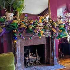 a living room with a fire place decorated for mardi gras and decorations on the mantle