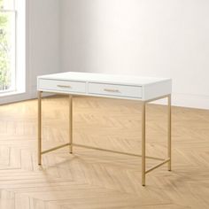 a white desk sitting on top of a hard wood floor next to a large window