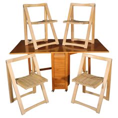 four wooden chairs sitting on top of a table with one chair in front of the other