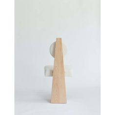 a sculpture made out of wood and white fabric