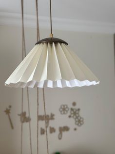 a lamp hanging from a ceiling in a room