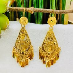 Beautiful and stunning handmade Mexican Filigree Earrings. Each piece is meticulously created out of copper wire and spun into a beautiful design. To give it the final touch artisans dipped into gold plate for it's gold color. This accessory is an important part of the traditional Tehuana outfit from Oaxaca, Mexico. Look elegant while wearing Mexico's culture with this one of a kind earrings! Approximate length: 3-3.5 in Need more than one? Ask us about our combined flat rate shipments for multi Traditional Nickel-free Jewelry For Celebration, Handmade Ornate Chandelier Earrings For Festive Occasions, Traditional Drop Earrings Nickel Free, Traditional Metal Dangle Clip-on Earrings, Traditional Nickel-free Earrings For Celebration, Gold Bohemian Beaded Pierced Earrings, Artisan Pierced Earrings For Wedding, Bohemian Metal Drop Bridal Earrings, Gold Plated Filigree Dangle Jewelry