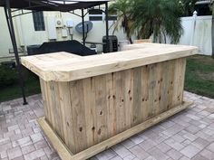 an outdoor bar made out of pallet wood