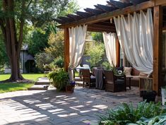 a covered patio area with chairs and tables