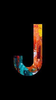 the letter j is painted with colorful paint