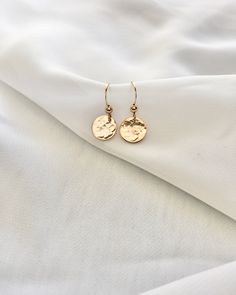 Classy and sophisticated. Elevate your look with our small hammered disc earrings. These simple statement earrings have a hammered texture design. Lightweight for everyday wear. Available in 14k Gold Filled or Sterling Silver. Details: Simple And Delicate Everyday Earrings (Sold As A Pair) Small Accent Disc - Approxima Wire Design, Rose Quartz Necklace, Disc Earrings, Silver Anklets, Delicate Earrings, Everyday Earrings, Elevate Your Look, Quartz Necklace, Texture Design