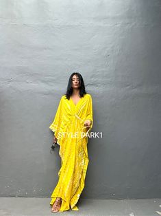 Uluwatu Kaftan dress" Soft, Smooth, Lightweight Rayon voile Fabric. Perfect for Elegant Day and Nightwear or worn as a cover-up for that beach or poolside statement of glamour. And for Muslim women   Color - Bali  Tie Dyed Lemon yellow & multi motif Measurements in CM and Inches.  Size American measurement is Medium to Large.  It fits all the body sizes between M to2XL Size - One size  American size From M to 2XL Total wide /240cm/94inch(round) Chest & him /180cm/70inch(round) The length /140cm/ Flowy Long Maxi Dress For Eid, Festive Beach Kurta Maxi Length, Festive Beach Kurta In Maxi Length, Festive Maxi Length Beach Kurta, Festive Maxi Kurta For Beach, Summer Bollywood Style Floor-length Kaftan, Summer Bollywood Style Maxi Length Kurta, Bollywood Style Floor-length Summer Kaftan, Bollywood Style Summer Maxi Kurta