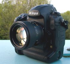 a nikon camera sitting on top of a table