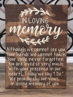 a wooden sign that says in loving memory