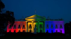 the white house is lit up in rainbow colors