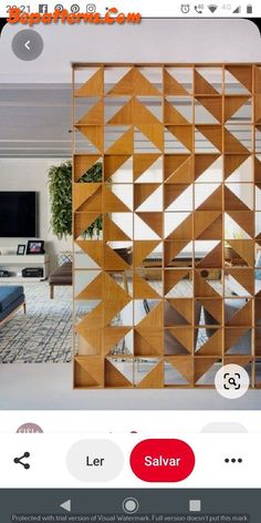 a room divider made out of wood with mirrors on the side and an image of a living room in the background