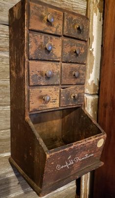 an old wooden drawer with metal knobs