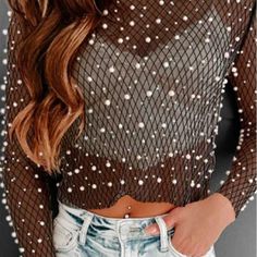 A Pearl Rhinestone Mesh Shirt That Is Both Fashionable And Durable, Made With Breathable Mesh For Comfort And Ease Of Movement. It Features Unique Pearl And Rhinestone Accents And Is Crafted From 100% Polyester For Longevity. Trendy Rhinestone Tops For Fall, Spring Stretch Tops With Rhinestones, Spring Party Blouse With Rhinestones, Rhinestone Crew Neck Tops For Party, Party Tops With Rhinestones And Crew Neck, Party Crew Neck Tops With Rhinestones, Glamorous Fall Tops With Rhinestones, Glamorous Long Sleeve Tops With Rhinestones, Mesh Shirt