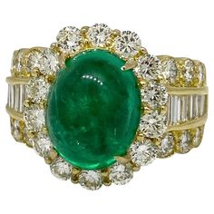 5.12 Carats Emerald Cabochon & Diamond Ring in 18k Yellow Gold Emerald Cabochon and Diamond Ring features one center Cabochon Emerald accented by Baguettes and Round Brilliant cut Diamonds set in 18k Yellow Gold. Total emerald weight is 5.12 carats. Total diamond weight is 2.33 carats. Ring size is 6.5 Ring weighs 13 grams. Ring dimensions are 0.65" by 0.85" and the ring rises 0.42" above the finger. Set in 18k Yellow Gold. Hallmarks: K18, E 5.12, D 0.44, 2.00 BUY WITH CONFIDENCE Authenticity is Colombian Emerald Ring, Yellow Gold Cocktail Ring, Statement Rings Diamond, Emerald Gem, Vintage Style Rings, Gold Cocktail Ring, Gold Cocktail, Colombian Emeralds, Diamond Cocktail Rings