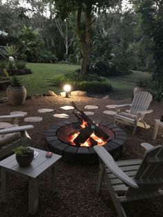 a fire pit with chairs around it