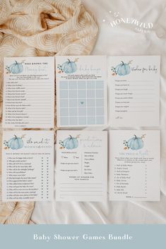 the baby shower games bundle is laid out on top of a white sheet with blue pumpkins