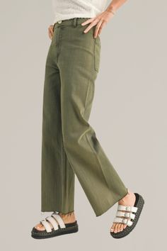 upgrade your casual wardrobe with these olive wide-leg cut-off denim pants, a versatile blend of comfort and contemporary style. crafted from premium denim with stretch, these pants feature a flattering high-rise waist and a wide-leg silhouette that offers a relaxed, yet chic look. the olive hue adds a touch of sophistication and pairs effortlessly with both casual tees and dressier tops. finished with a cut-off hem for a modern edge, these pants are ideal for creating effortless day-to-night ou