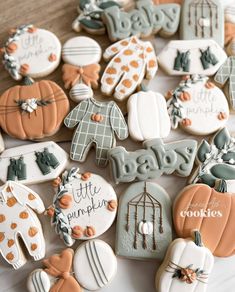 baby shower cookies are arranged on a table